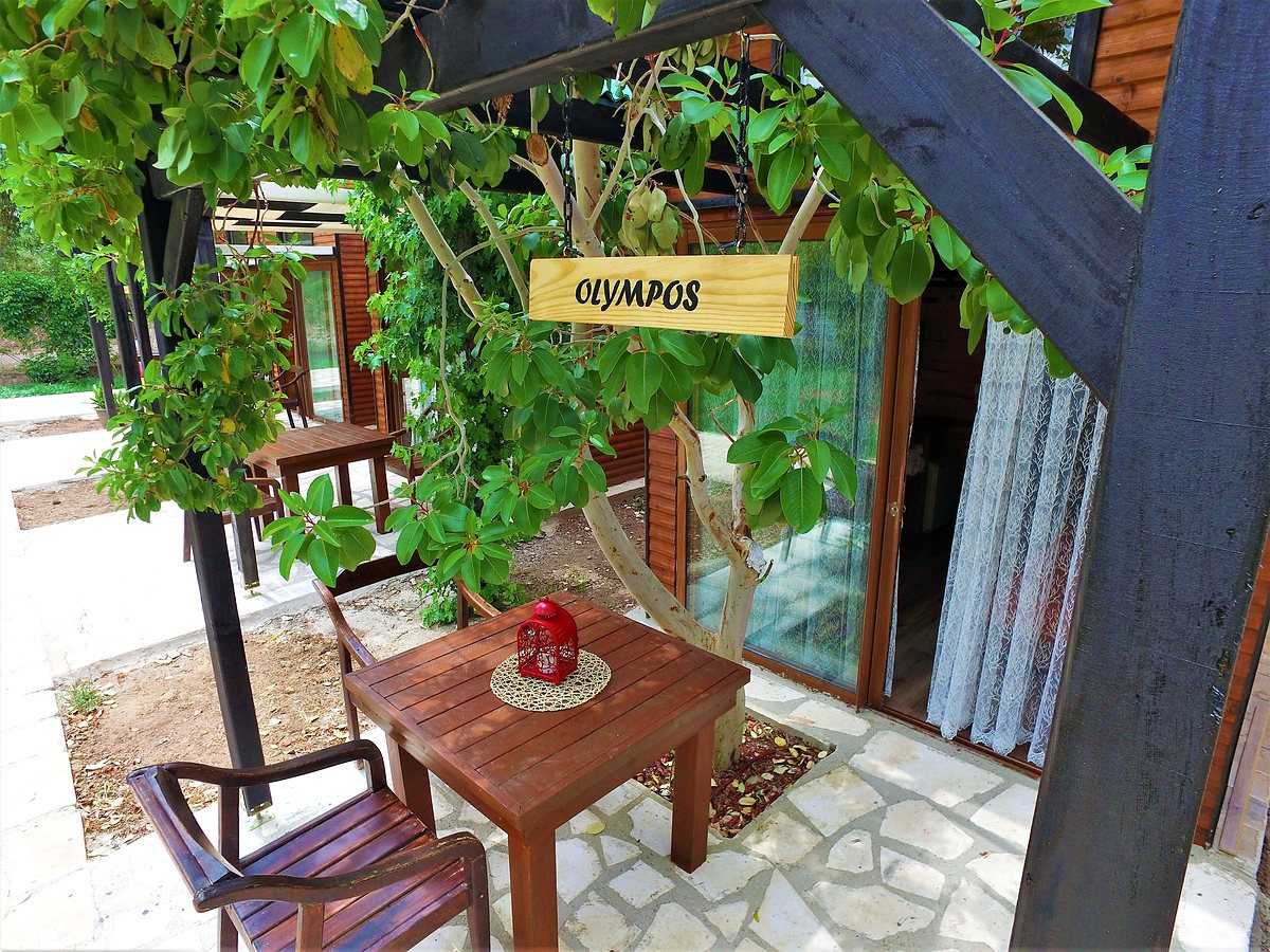 Duplex Bungalow: entrance terrace with an 'Olympos' sign and table