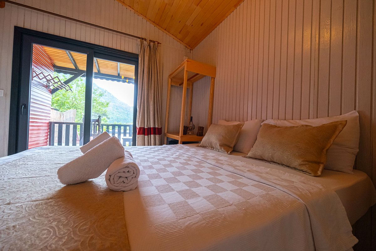 Terrace Bungalow: neatly made double bed